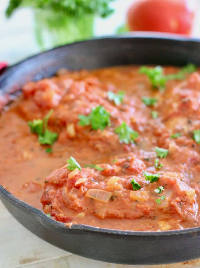 Fish in tomato sauce in a skillet