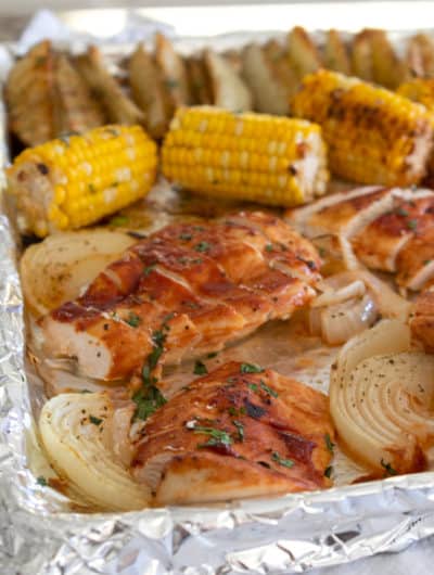 chicken corn and potatoes on a sheet pan