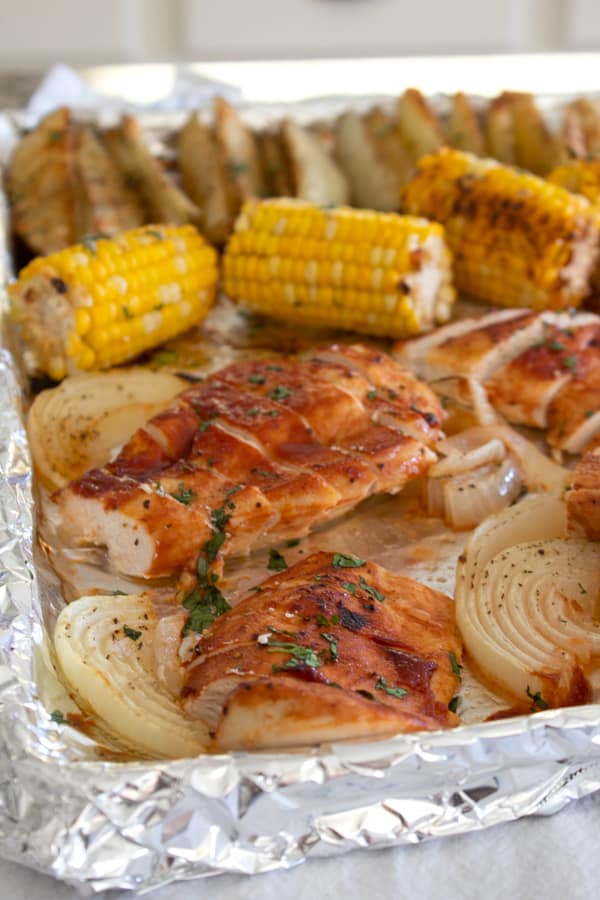 chicken corn and potatoes on a sheet pan