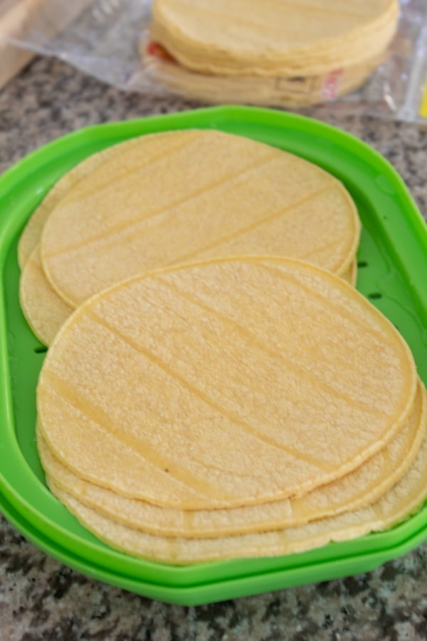 steaming corn tortillas