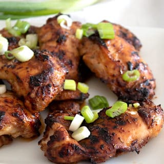 marinated chicken thighs on a plate