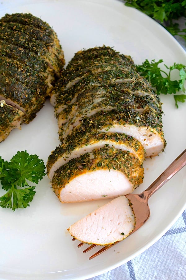 overhead view of turkey tenderloin on white plate