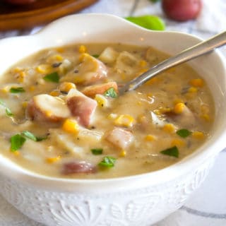 bowl of ham and corn chowder in white bowl