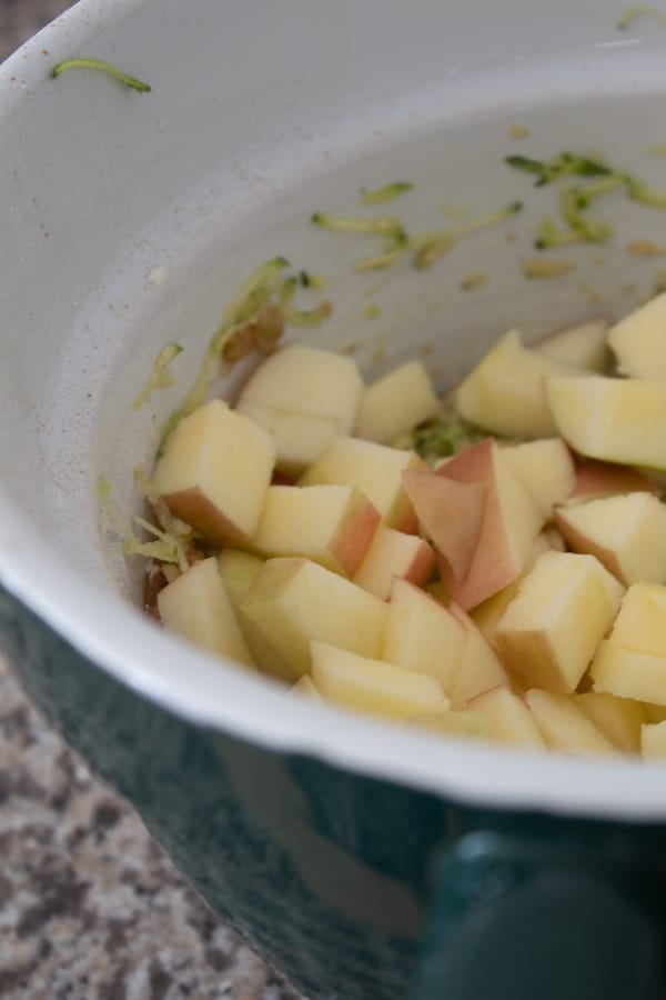 adding chopped apples to muffin batter