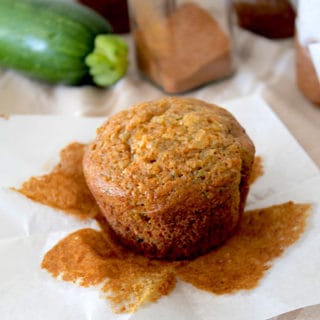 zucchini muffin peeled from liner on tea towel