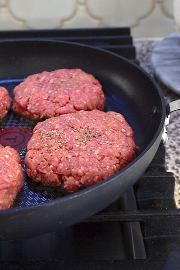 formed burger patties in a skillet