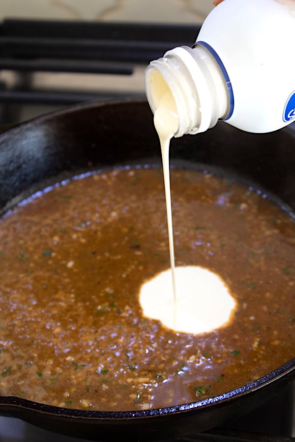 adding heavy whipping cream to pan sauce