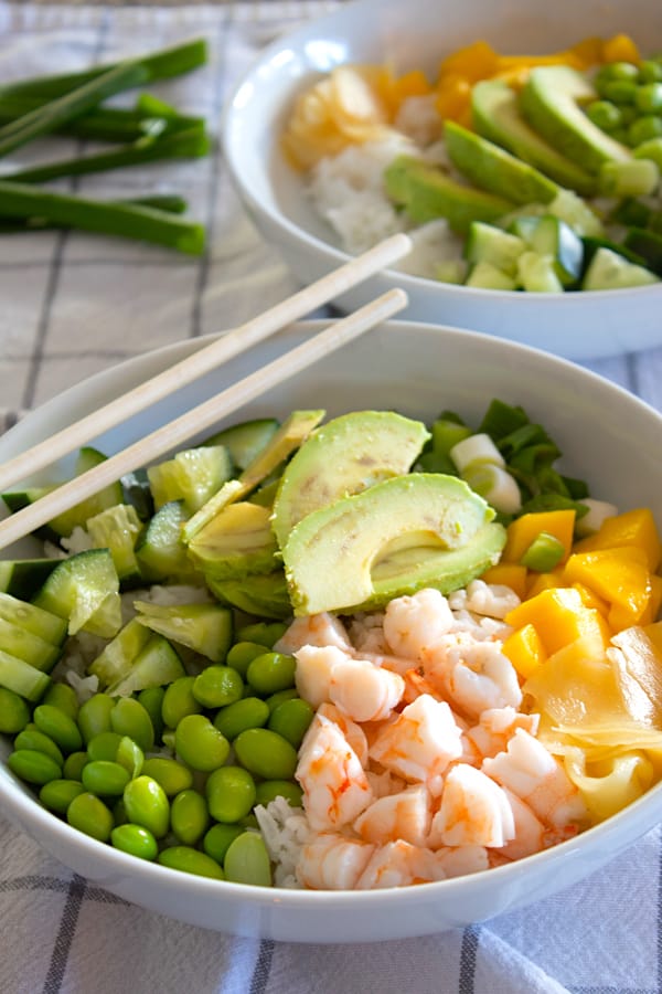 shrimp poke bowl with chopsticks on side of bowl