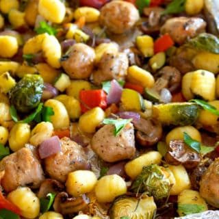 sheet pan of cooked gnocchi and vegetables with sausage
