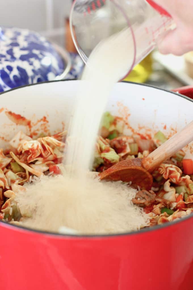 adding rice to the soup pot