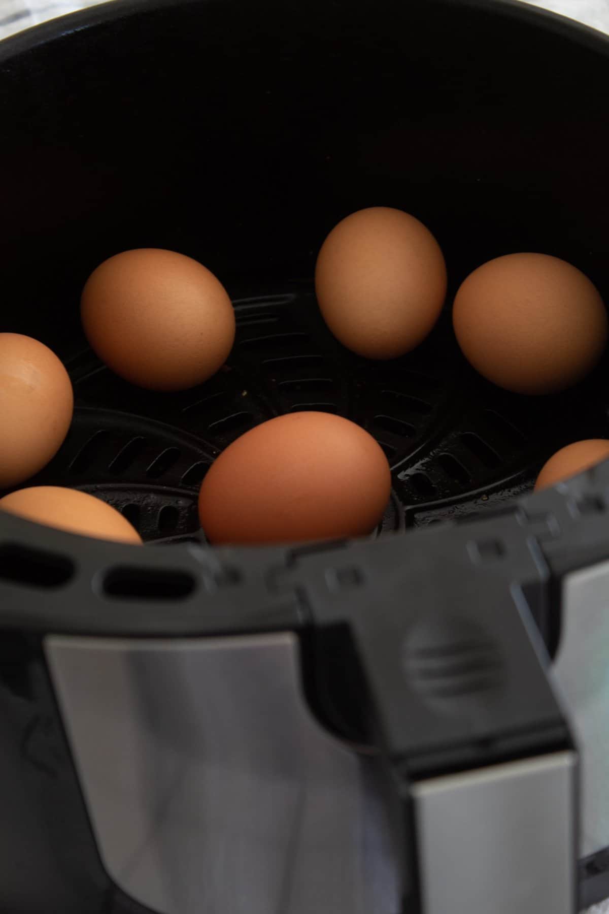 brown eggs in air fryer basket