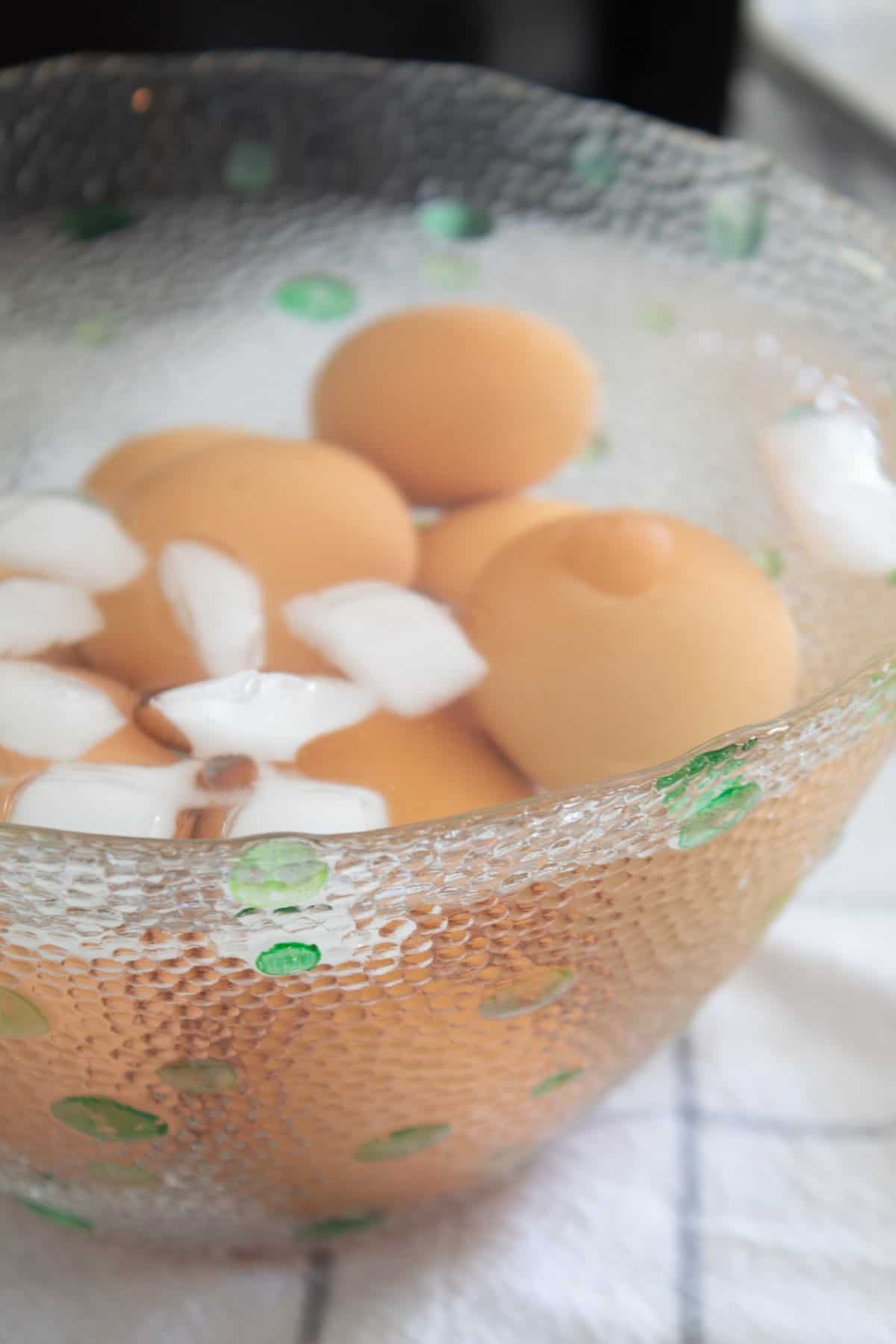 cooling hard boiled brown eggs in ice bath
