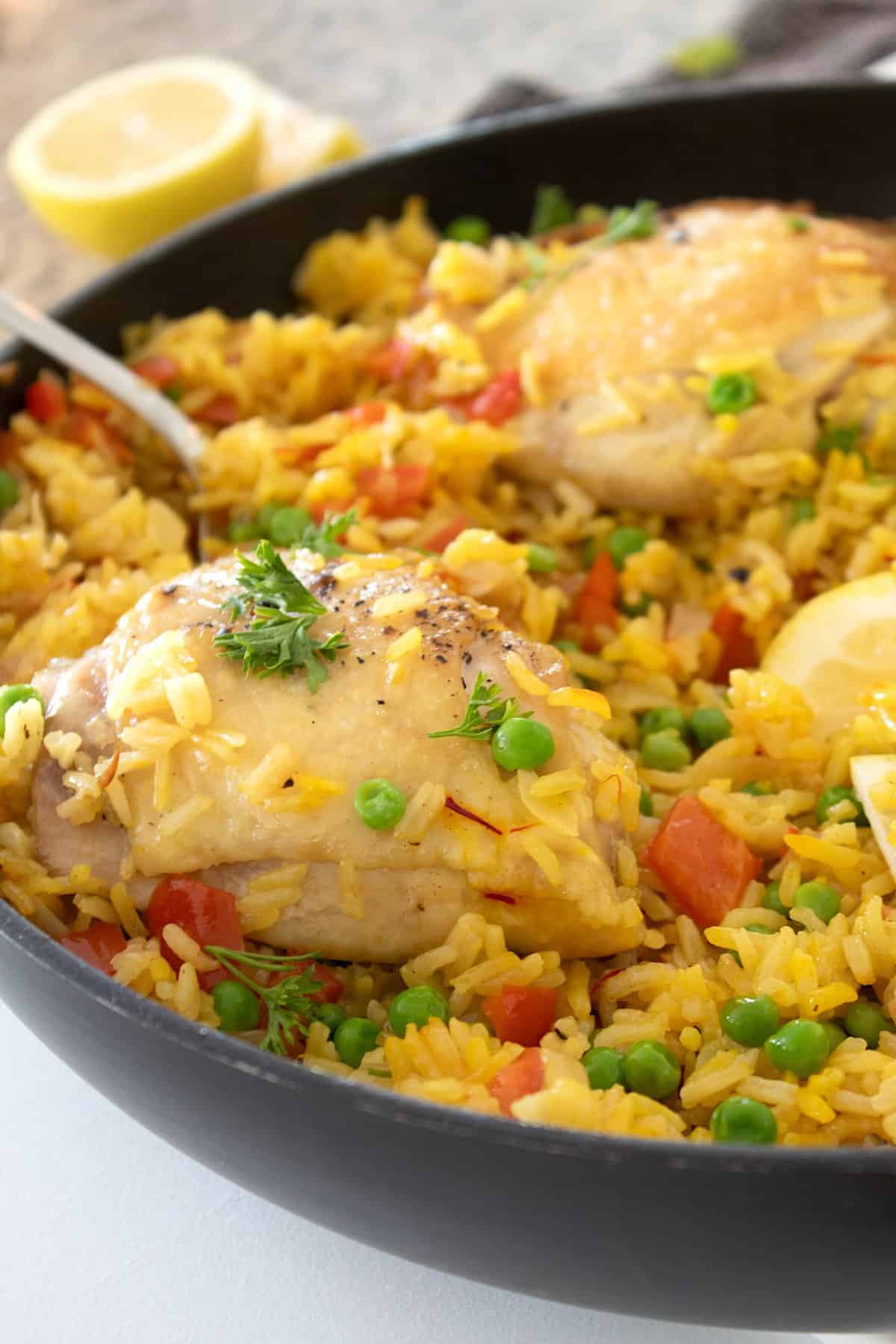 side view of arroz con pollo garnished with parsley