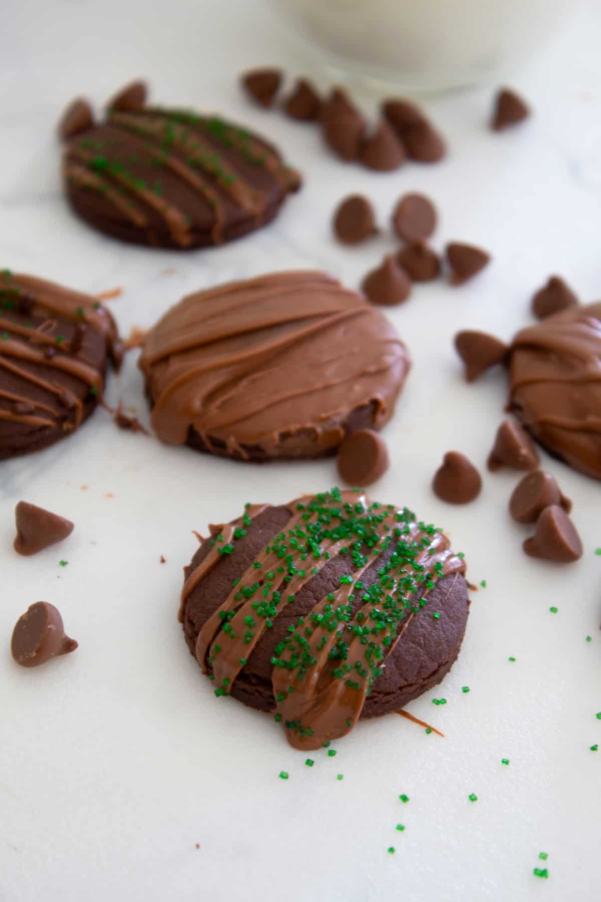 overhead view of thin mint cookies garnished with green sprinkles