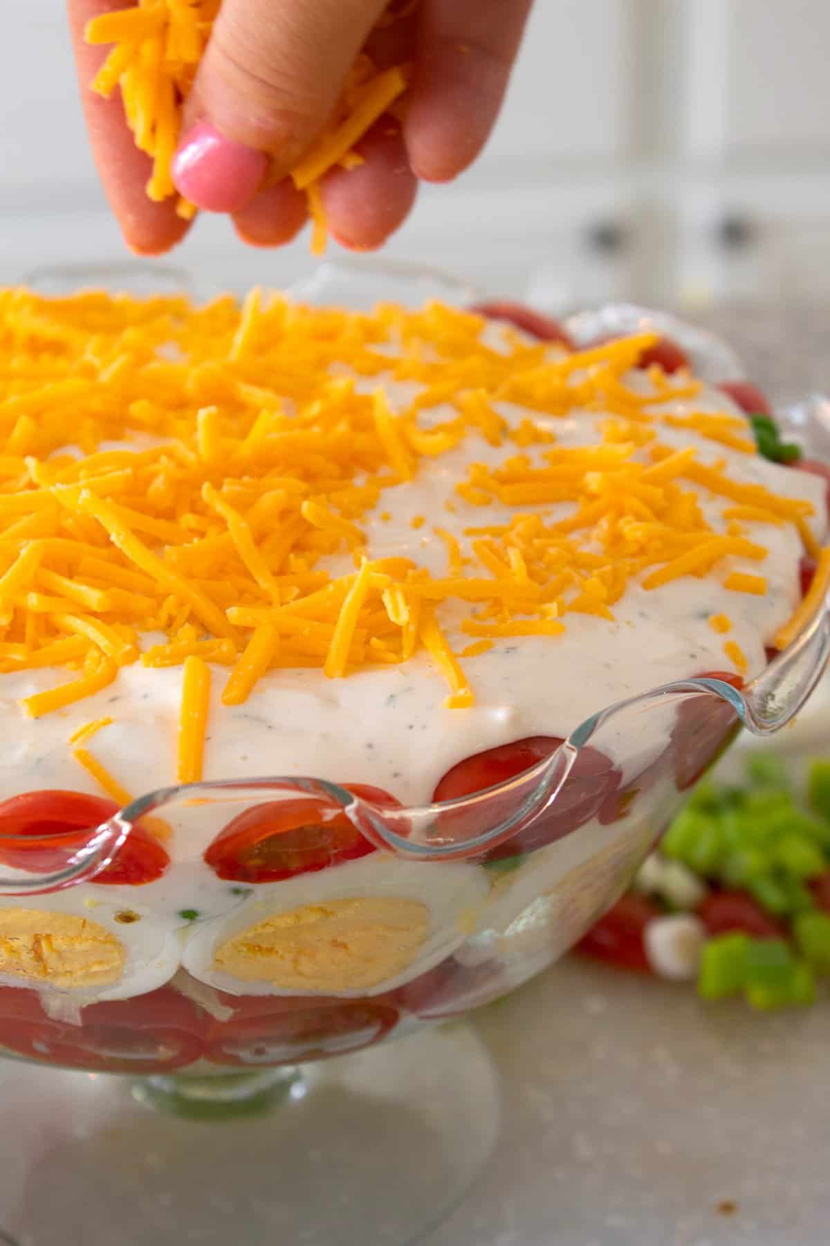topping salad with cheese