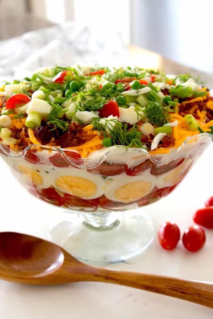 layered salad in a trifle dish