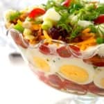 closeup of layered salad in a glass bowl