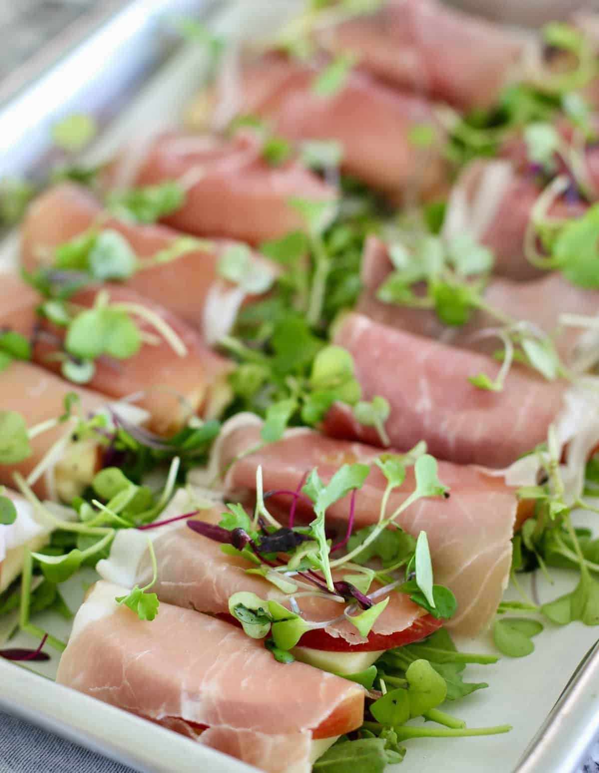 wrapped appetizers on a sheet pan
