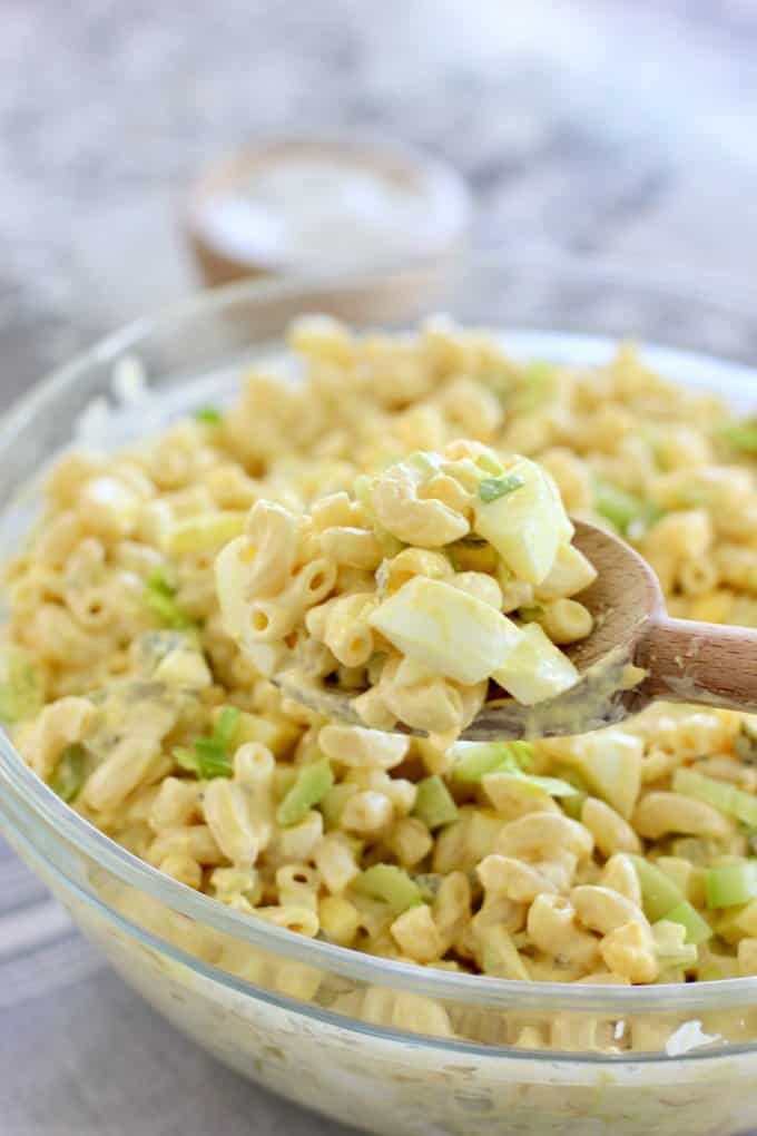 macaroni salad in a clear white bowl