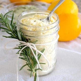 overhead view of mason jar filled with lemon salt with rosemary sprig garnish