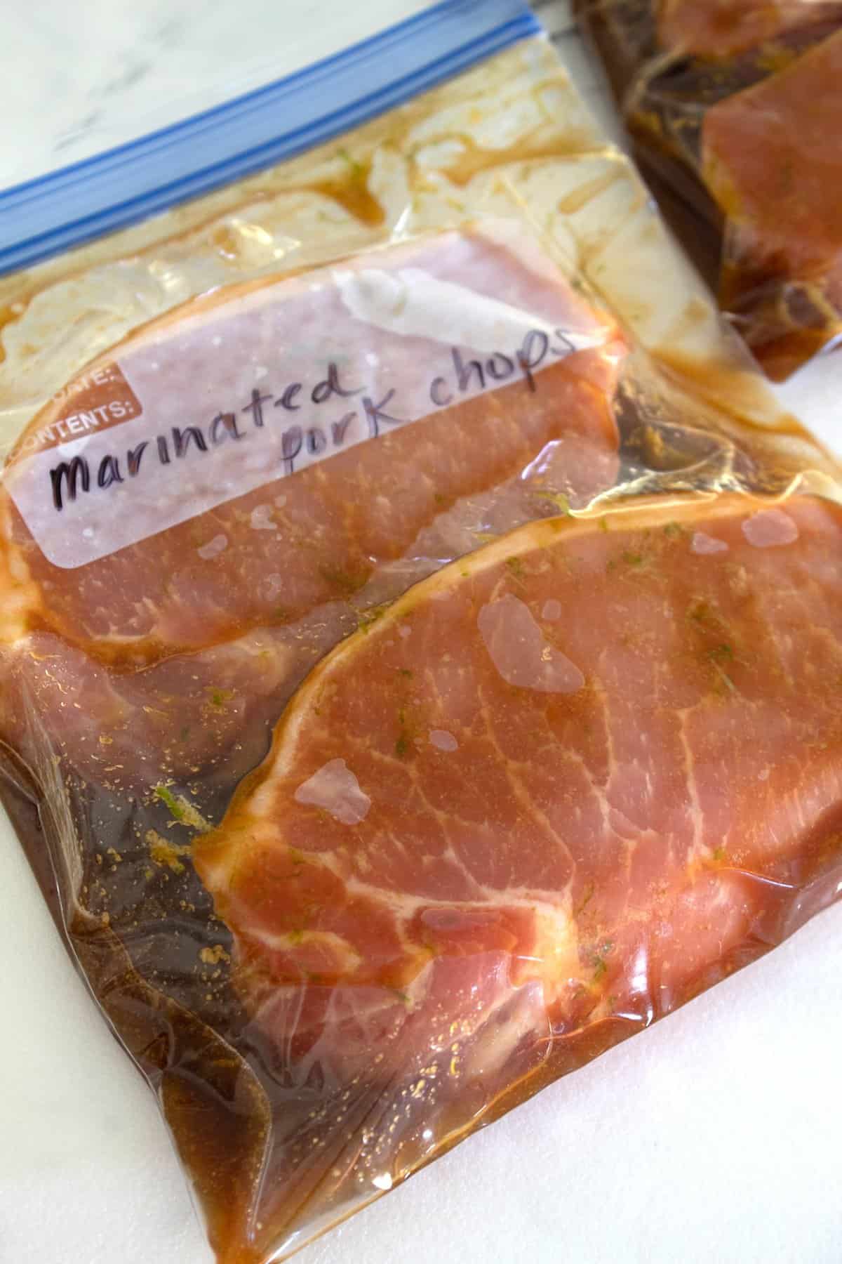pork chops marinating in ziplock bag