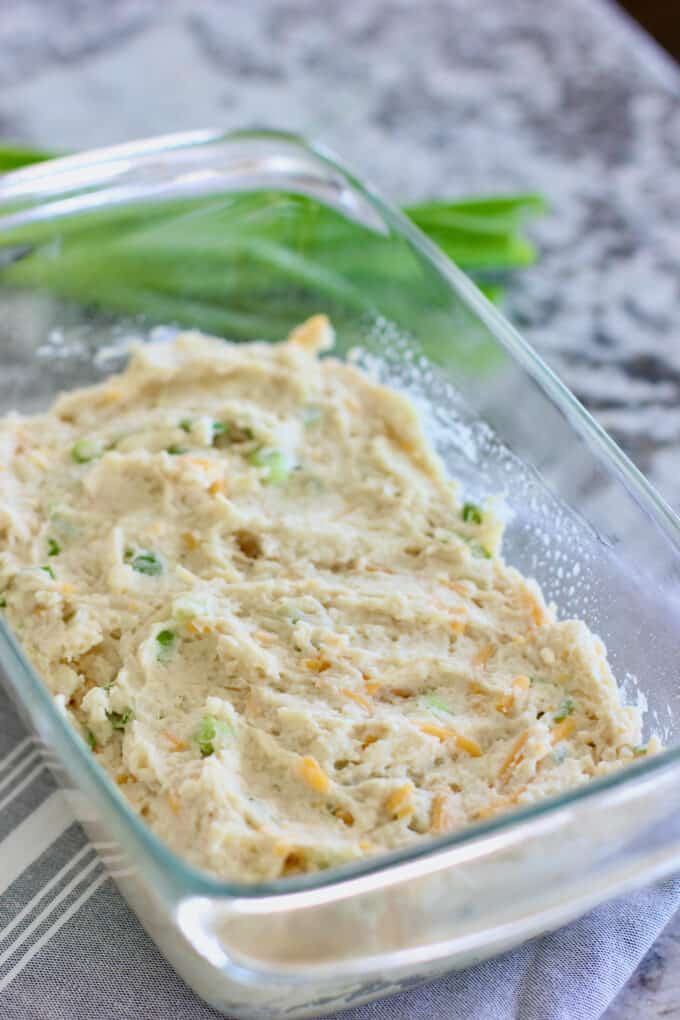 pour cheese bread dough into loaf pan