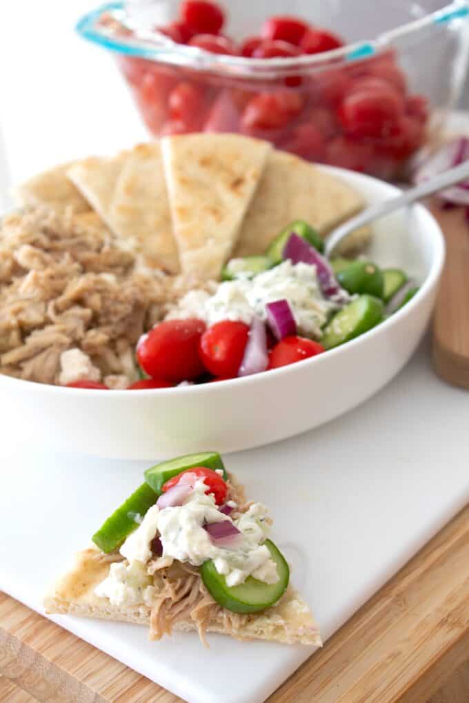 greek slow cooker chicken on pita bread