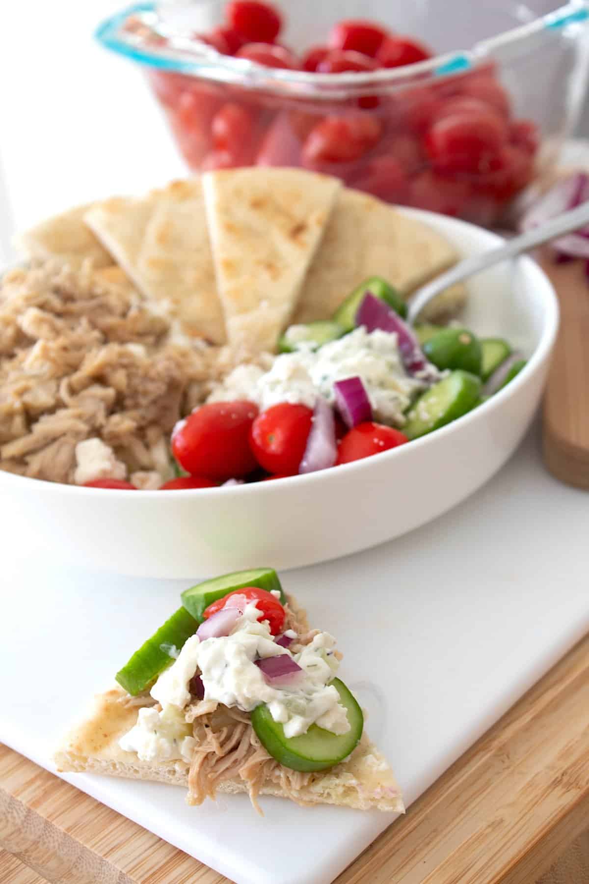 greek slow cooker chicken on pita bread