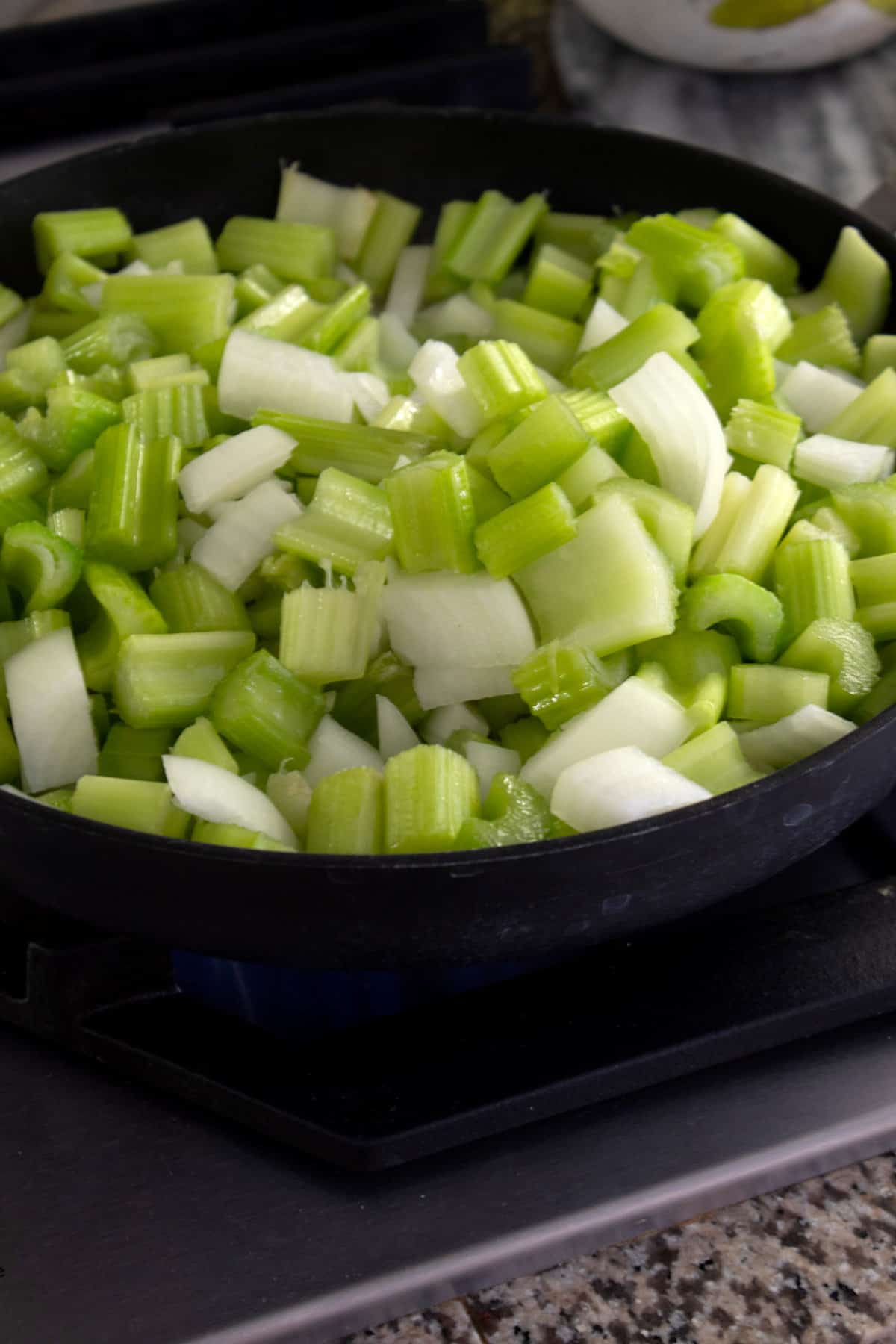 chopped celery and onion in a pan