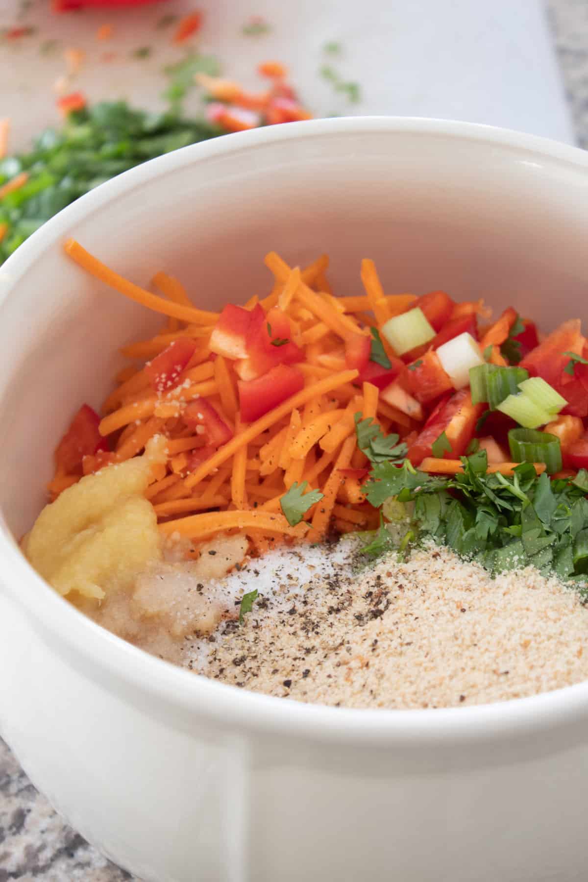 mixing ingredients in bowl for Thai Turkey meatloaf
