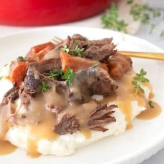 plated pot roast with gravy on a plate