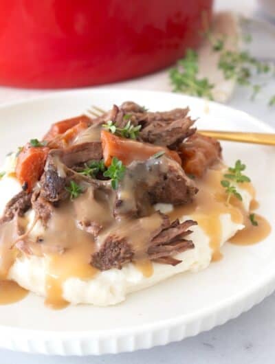 plated pot roast with gravy on a plate