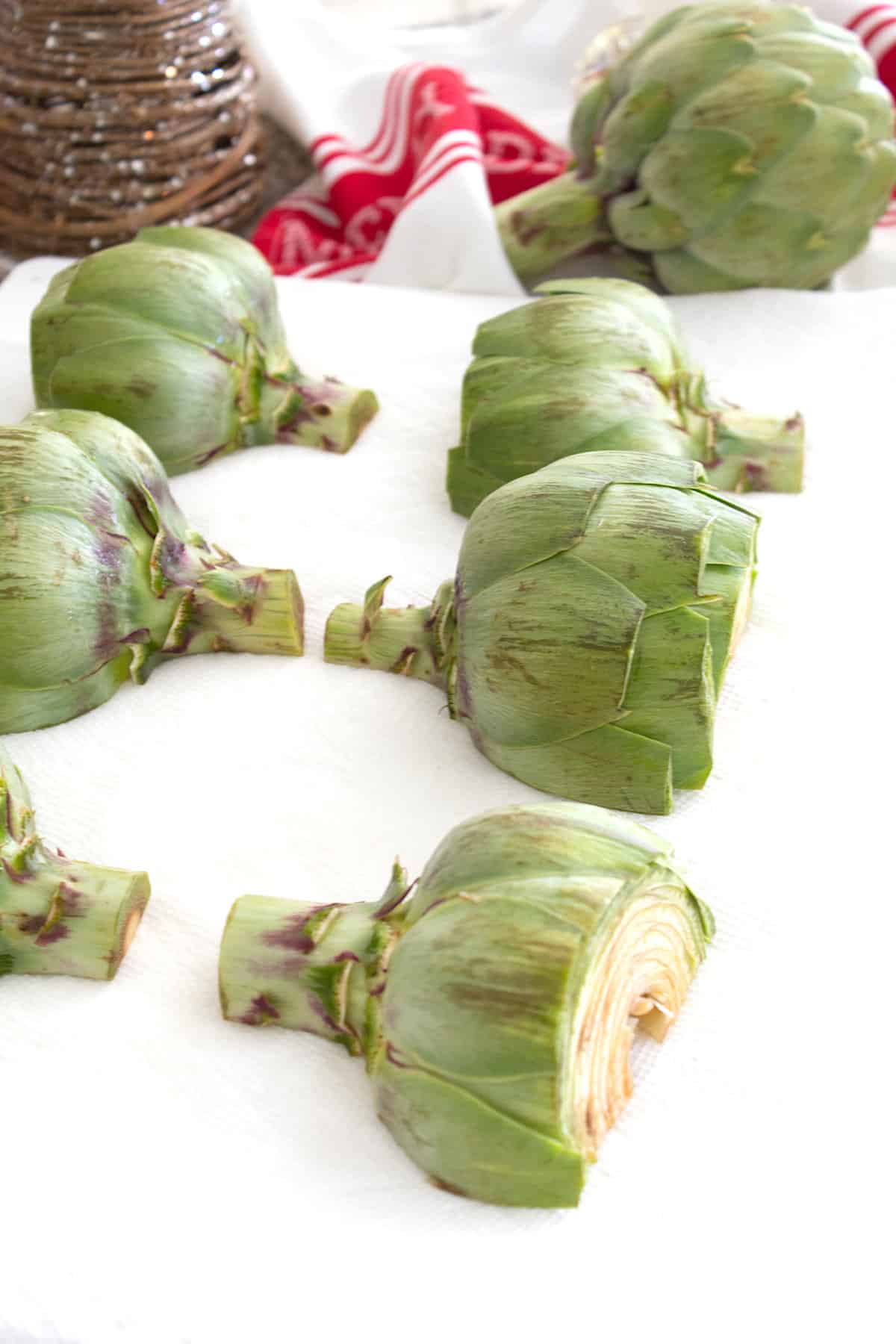 cleaned artichokes drying on paper towel