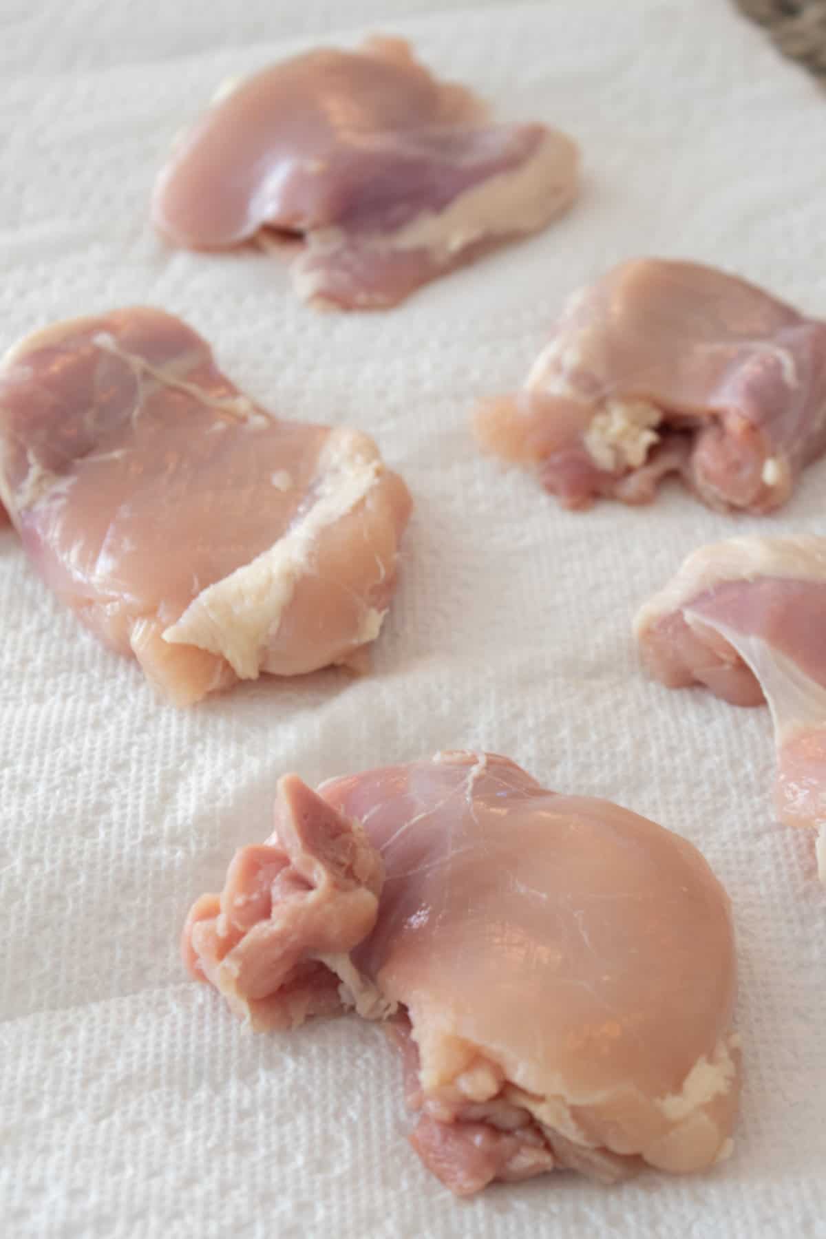 chicken thighs on paper towel