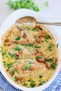 creamy baked chicken breasts in a casserole dish