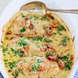 creamy baked chicken breasts in a casserole dish