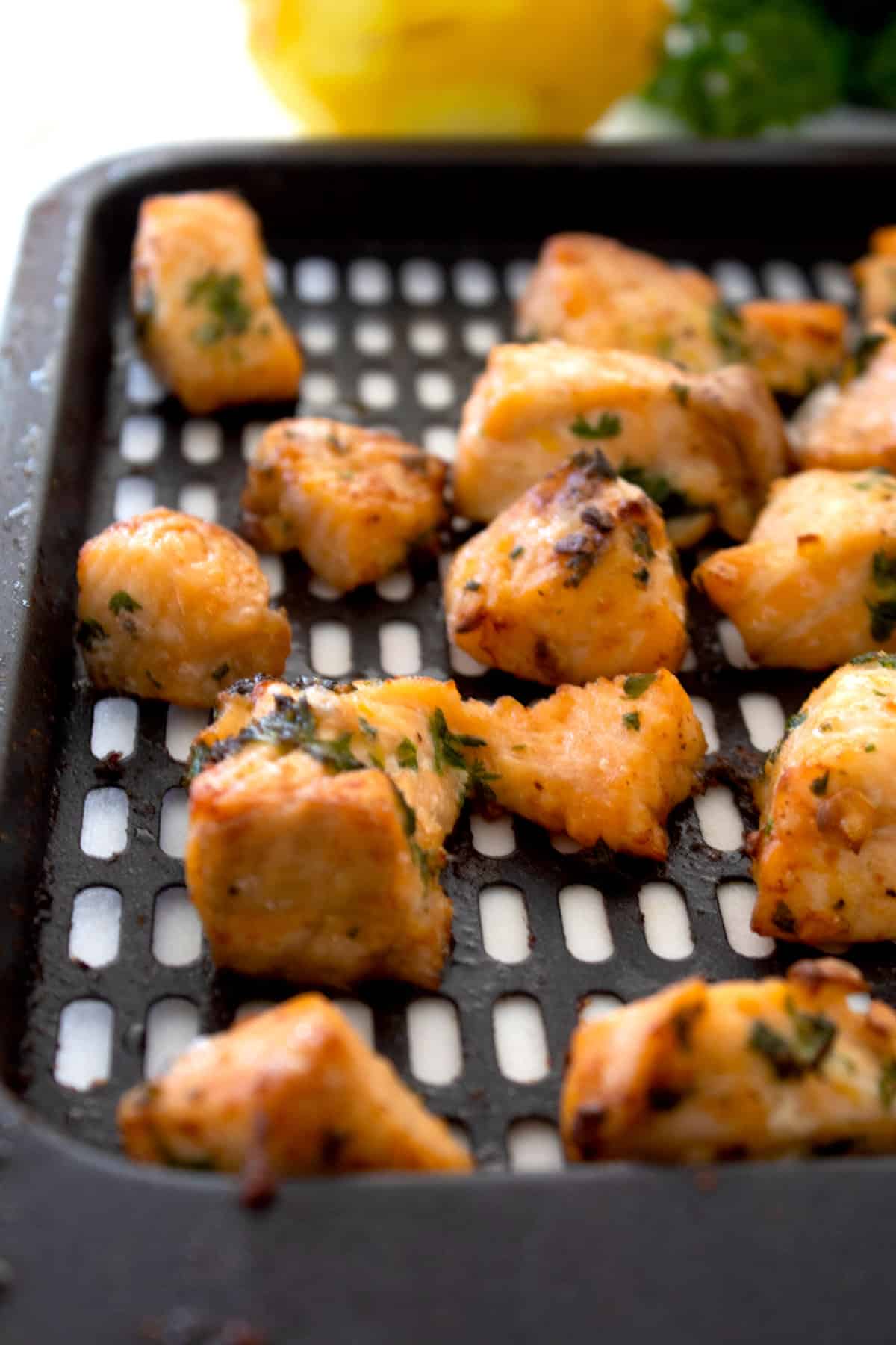 air fryer salmon bites on air fryer tray fully cooked
