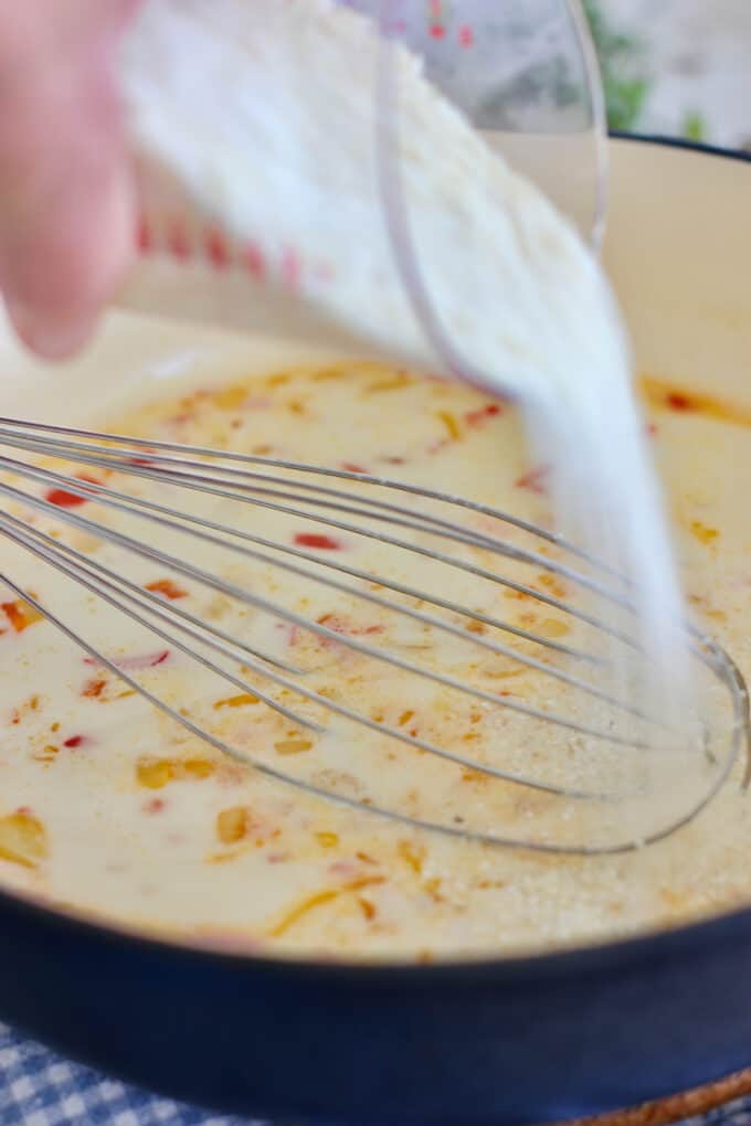 pour quick cooking grits into hot liquid