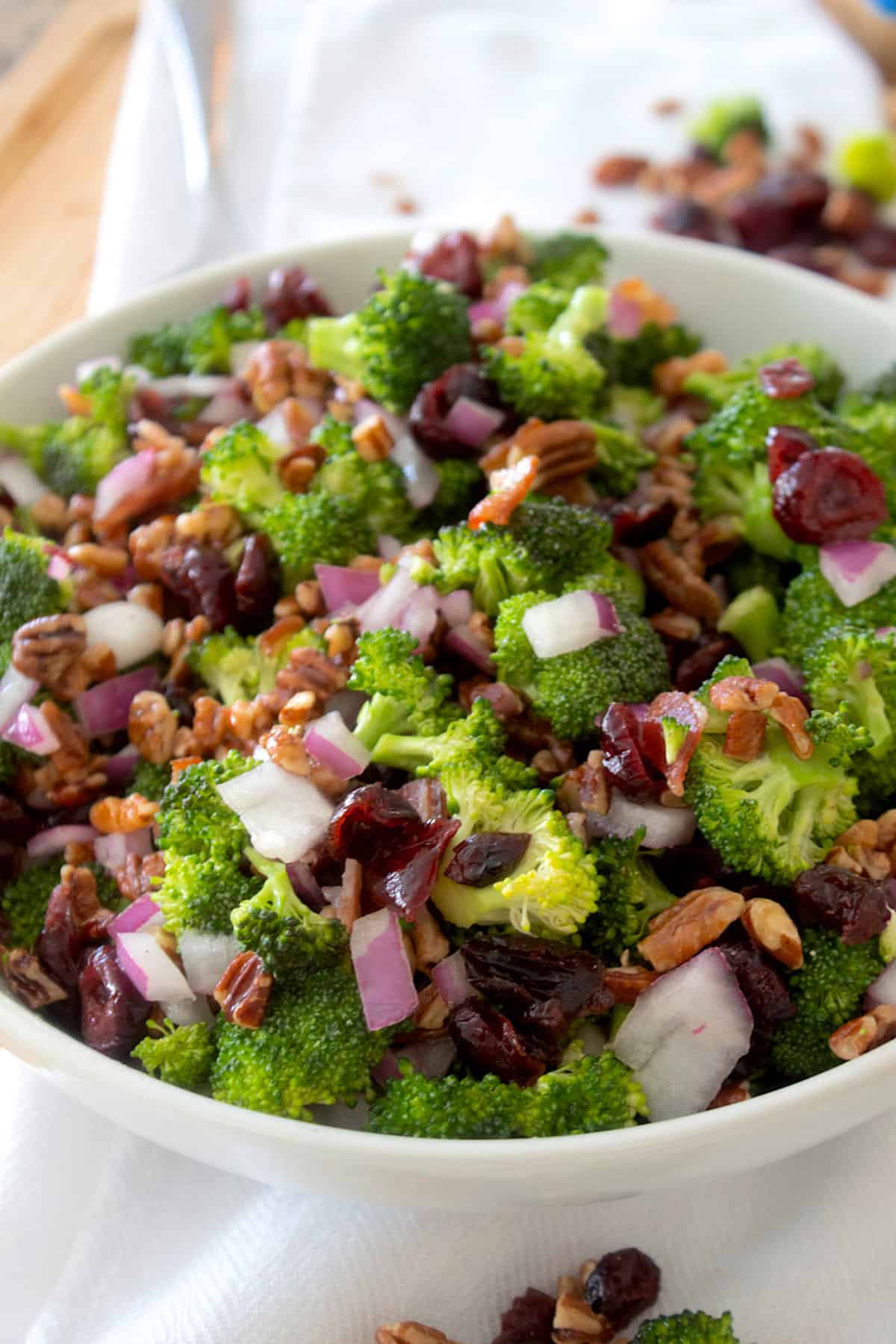 broccoli salad in a white bowl