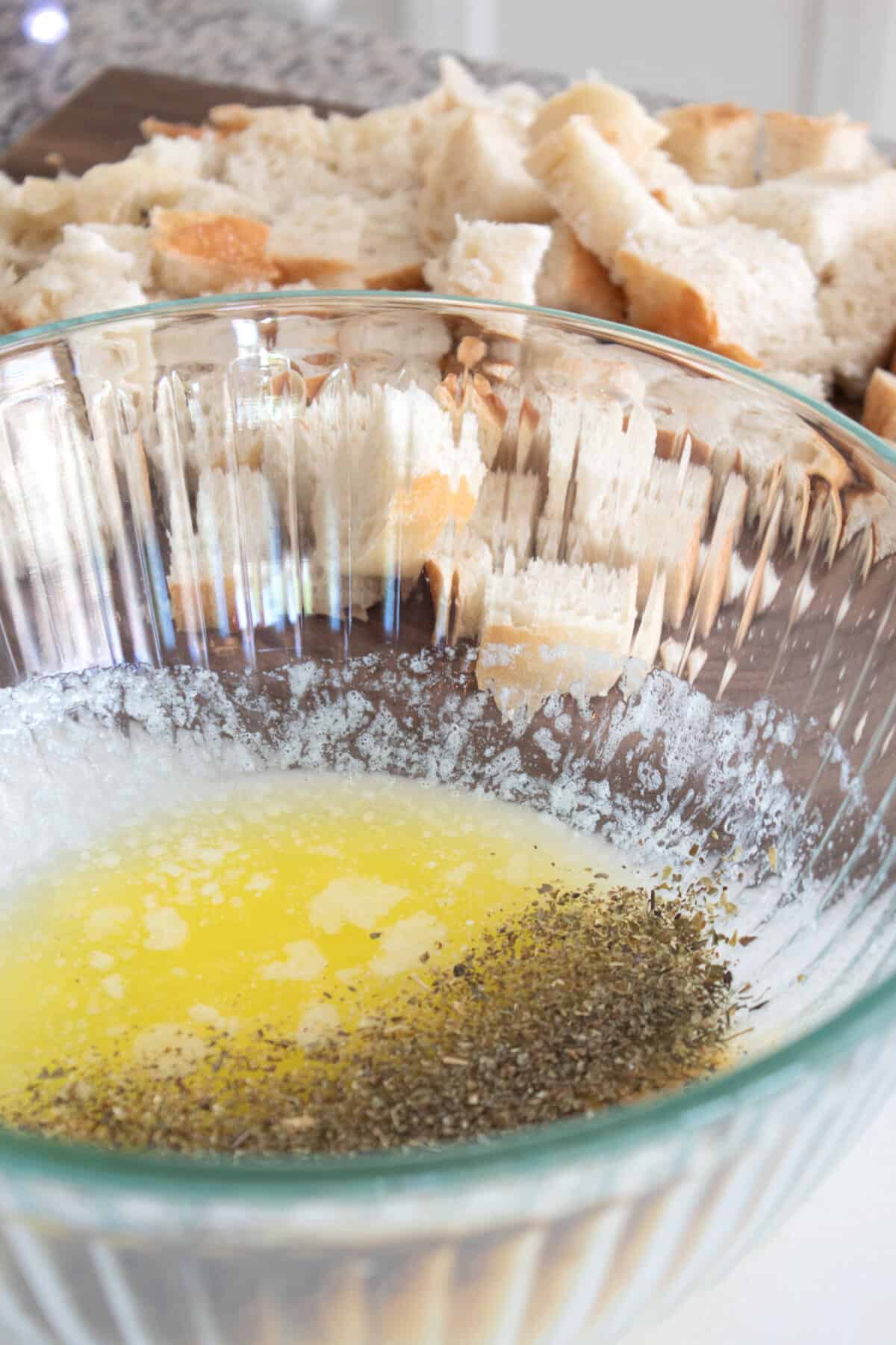 melted butter and herbs in a bowl
