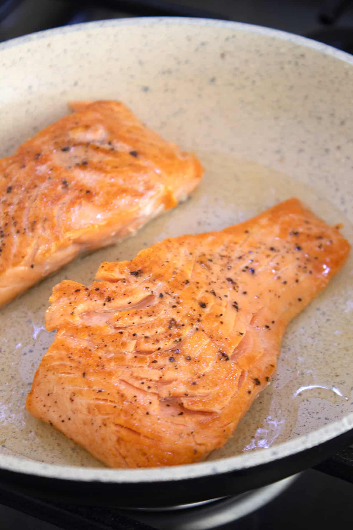 fully cooked salmon in a pan