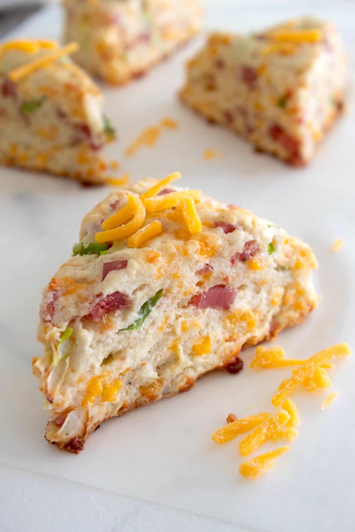 ham and cheese scones on a baking sheet