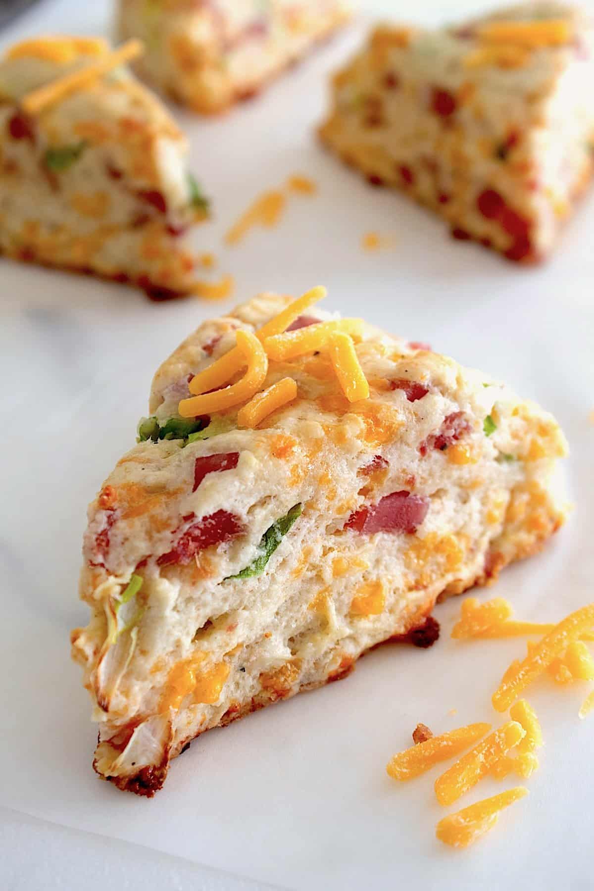 ham and cheese scones on a baking sheet