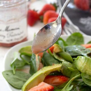drizzling salad with strawberry dressing