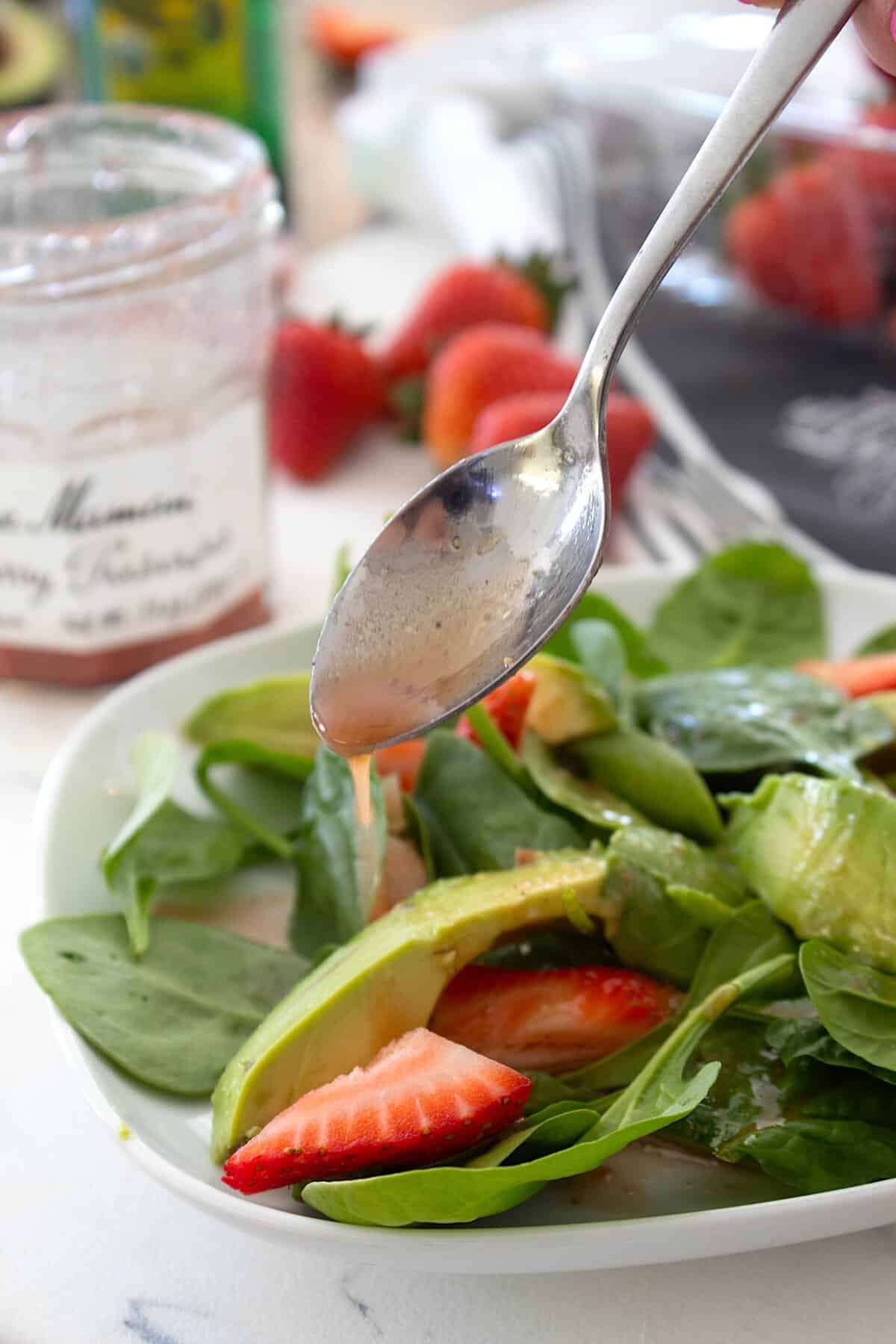 drizzling salad with strawberry dressing