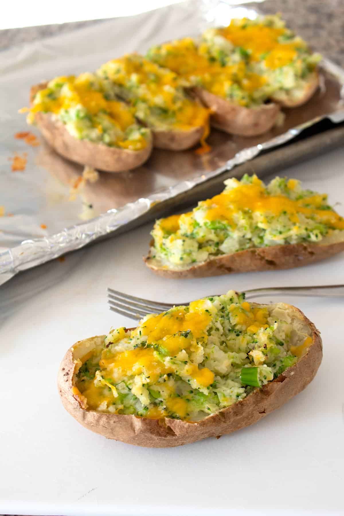 broccoli cheddar potatoes with fork