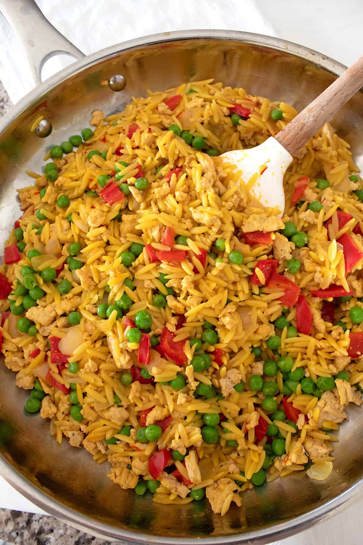 overhead view of ground chicken orzo skillet dinner