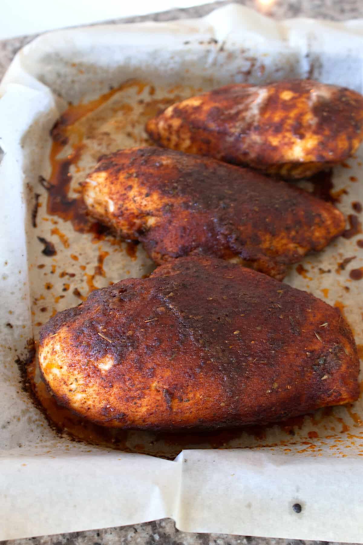 baked blackened chicken breasts on sheet pan