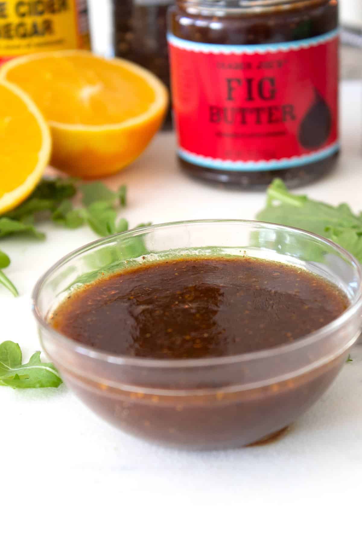 orange cinnamon fig dressing in a small glass dish