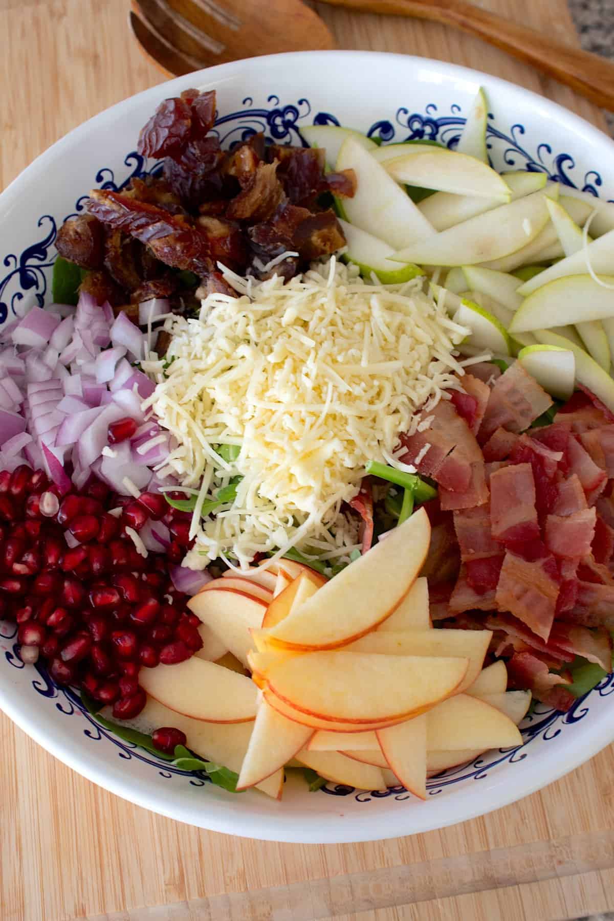 overhead shot of winter salad ingredients in a bowl